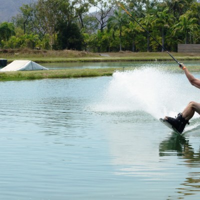 boy doing cable ski wakeboarding on the waterpark