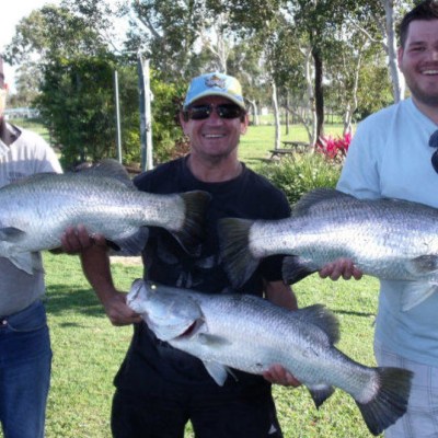 group of guys holding a massive fish