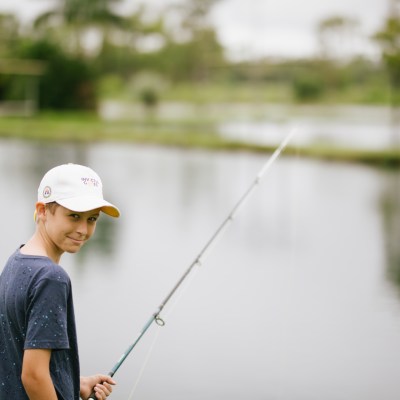 a boy with a fishing rod