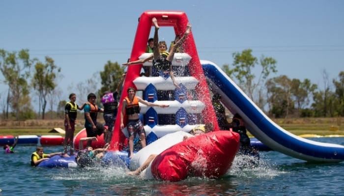Townsville Barra Fun Park Water Splashing Fun a group of people riding on the back of a boat