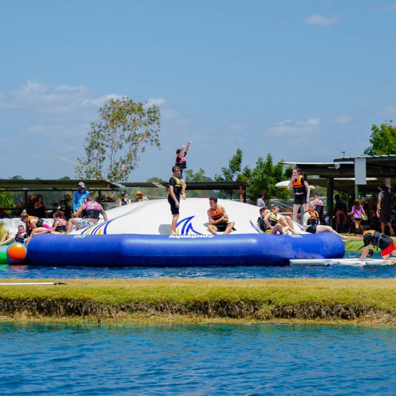 a group of people in blue water